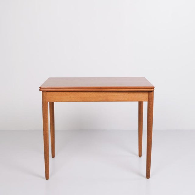 Hans j. Wegner game/dining table for andreas tuck. Teak and oak, 1960s. Built-in storage. — origin: denmark — designer:...