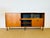 Vintage Scandinavian teak sideboard dating from the 1960s. Features a sliding door, a hinged door, and ample storage....