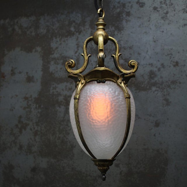 Classic French gilded brass Art Nouveau hall lantern. Brass frame and gallery with balloon-shaped etched glass. Around...