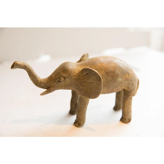 :: Vintage handmade African elephant sculpture. Circa late mid 20th century, though possibly older, this piece has such...