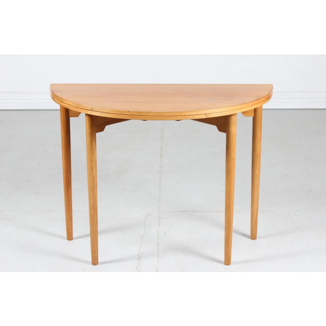 Round table/card table model 2081 by the Danish architect Hans J. Wegner (1914-2007) and manufactured by Fritz Hansen A/S...