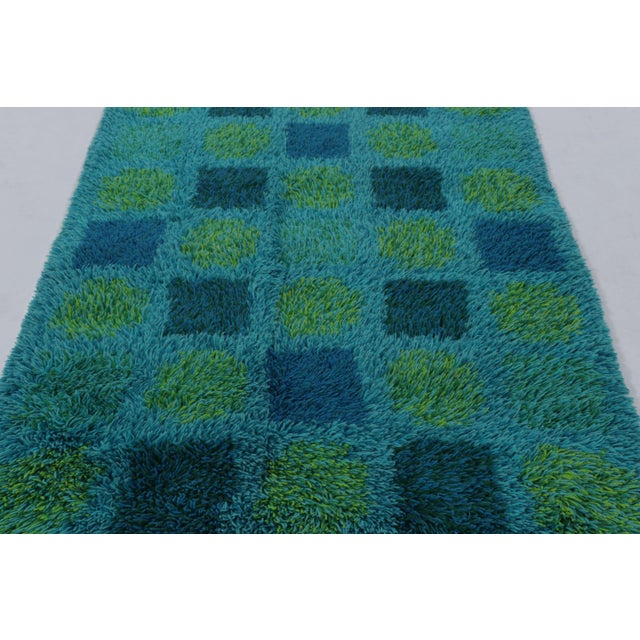 Hand-knotted in high-pile wool in Sweden circa 1960-1970, this 4x6 vintage Swedish Rya rug is a bold new addition to Rug &...