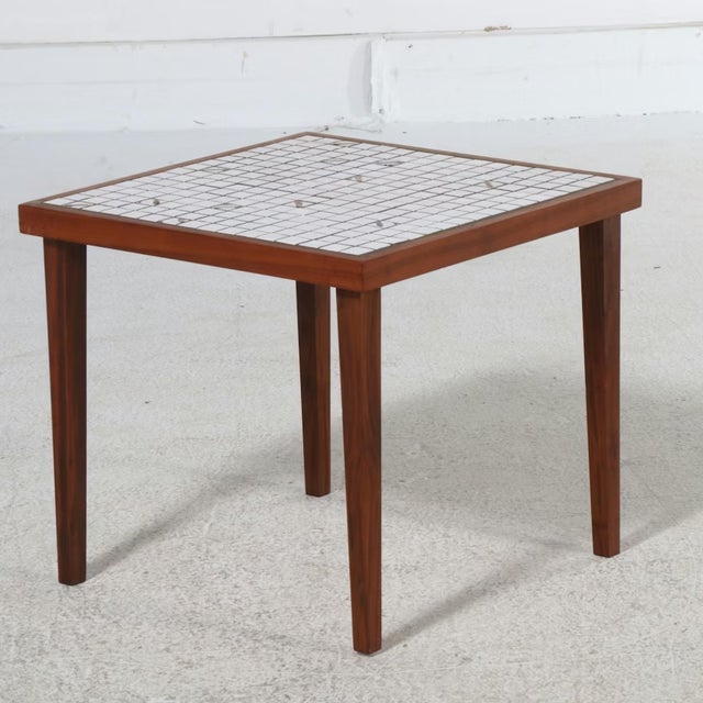 A rare pair of walnut and ceramic/porcelain tile side tables attributed to mid-century designers Gordon and Jane Martz,...