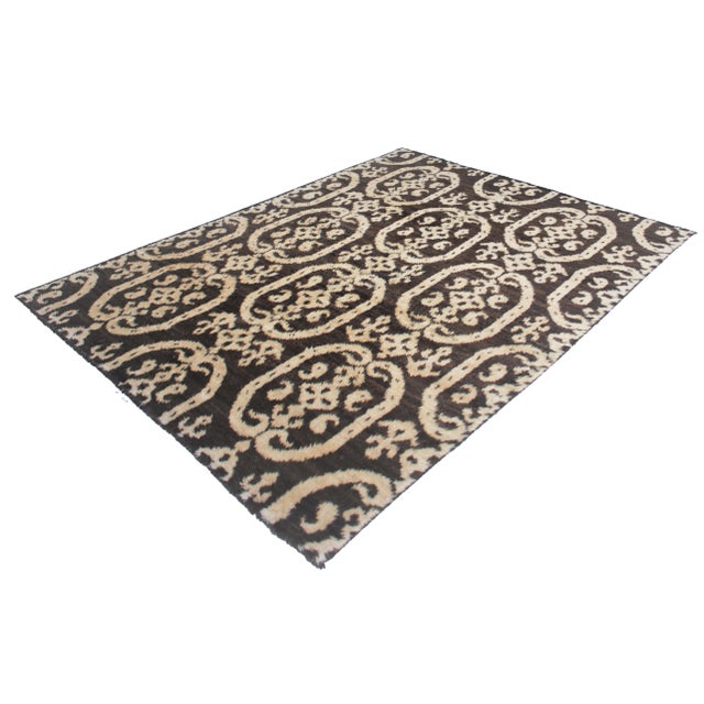 This beautiful Ikat rug is hand knotted in 2020's in Afghanistan with Floral design woven of 75% wool and 25% cotton. This...