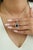 This halo pendant showcases a 2.57 carat blue sapphire set in 14k white gold. The sapphire measuring approximately 9.9 x...