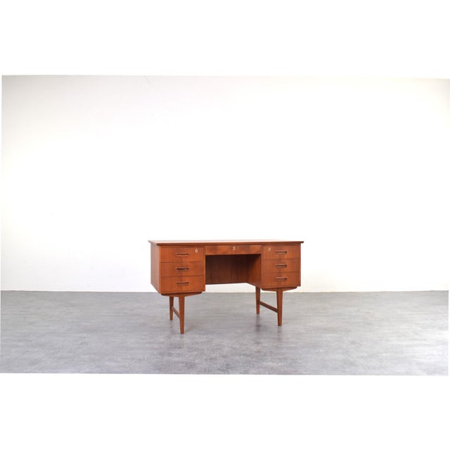 A classic Danish teak desk, crafted in the 1960s, is a perfect example of mid-century modern design. The design combines...