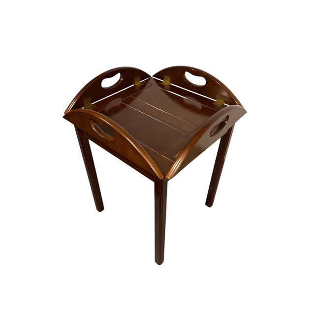 English Butlers Table from 1970s, in mahogany and solid brass. The table top can be used as a tray and is placed on a...