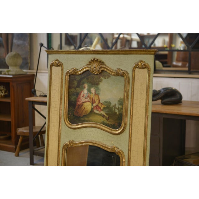 Trumeau Mirror with Crackled Patina and Oil on Panel Depicting a 19th-Century Romantic Scene, in Very Good conditions....