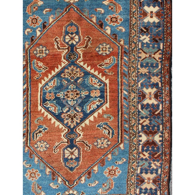 Measures: 3'10 x 5'7 Antique Persian Karadjeh rug with tribal medallion in rust red and bright blue. Keivan Woven Arts rug...