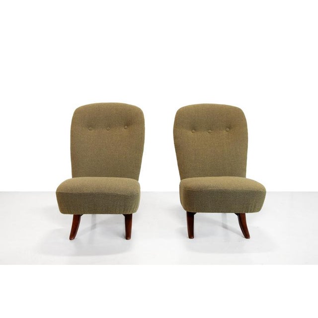 A set of two beautiful Congo chairs by Theo Ruth for Artifort. The armchairs are inspired by the two-piece chairs of...