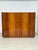 Impressive wardrobe in a mid-century design. This piece of furniture captivates with its generous proportions, exceptional...
