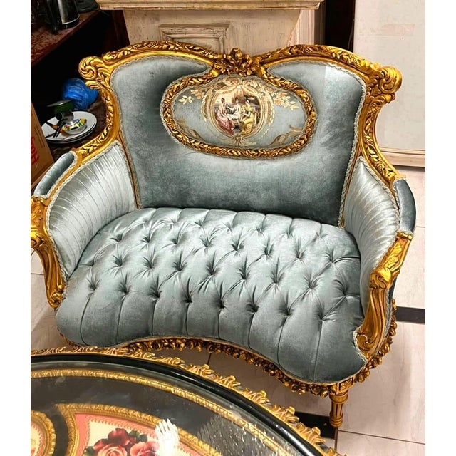 Bring timeless romance into your home with this breathtaking French Louis XV loveseat sofa, upholstered in sumptuous sky...