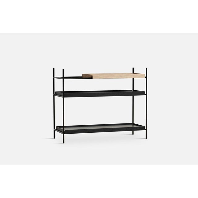 Low oak and black tray shelf ii by hanne willmann. Materials: metal, oak. Dimensions: d 40 x w 100 x h 81 cm. Also...