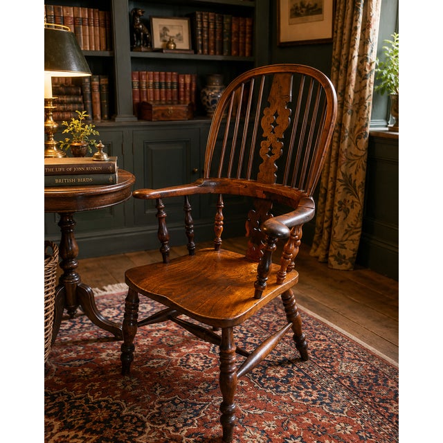 A superb antique yew wood Windsor armchair of exceptional colour and character. This charming country house chair features...