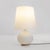 Medium-sized model 1853 table lamp designed by Max Ingrand and produced by Fontana Arte in the 1960s. Made of white satin...