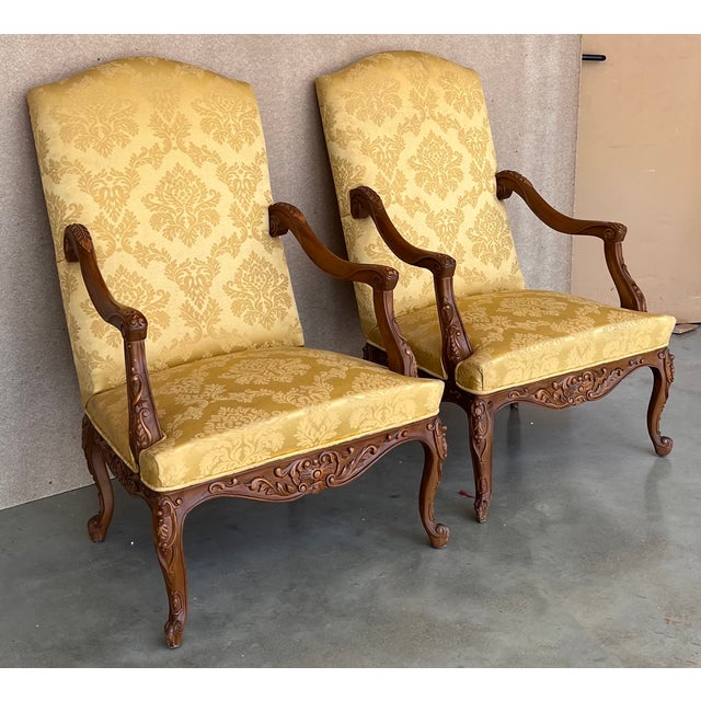 Louis XVI style pair of carved armchairs, Spain, 1900s. Good antique condition with some minor marks from used and age....