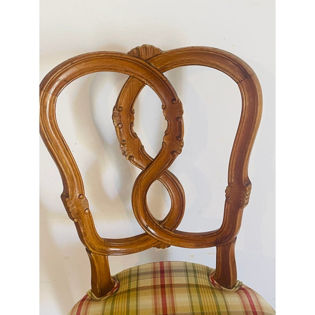 Elegant French country antique chair , handcarved walnut on cabriole legs, upholstered in plaid silk.