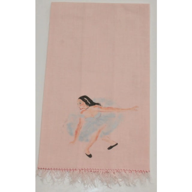 This is a one-of-a-kind hand-painted pink hand towel depicting a ballerina taking her bow. She is wearing blue with dark...