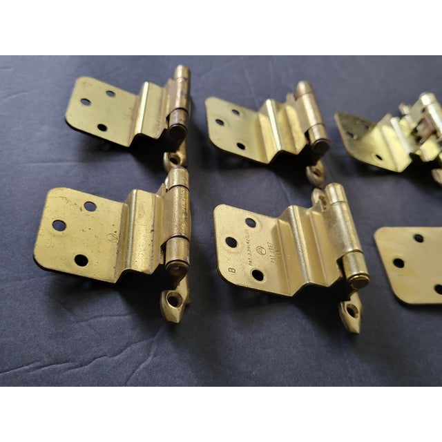 These 1967 door hinges are made of brass with a patina finish. The original mounting screws are not available. Good...