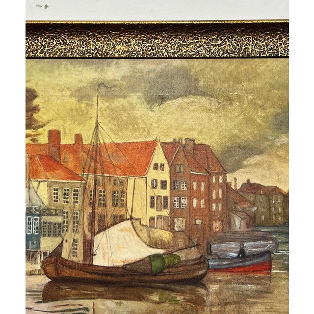 An early 20th century oil of Dutch pink boats and canal houses by the well listed Anglo-Dutch artist Nico Jungmann...