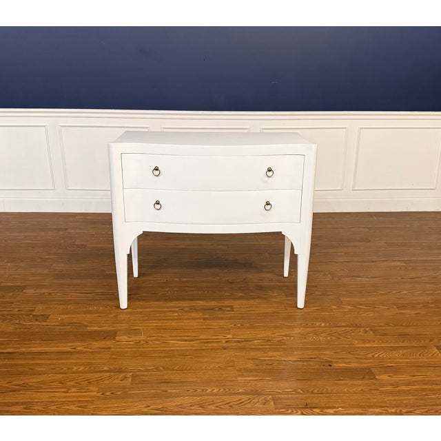 This is a White Serpentine Two Drawer Accent Chest. We believe it is made by Highland House, but we are not positive. It...