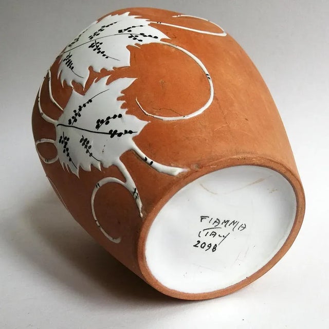 This vintage decorative ceramic vase features floral motifs and is signed 'Fiamma, n.22098'
