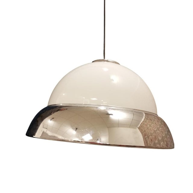 Pendant lamp in white opal glass with a chromed metal diffuser, featuring a vintage design. It has a diameter of 50 cm and...