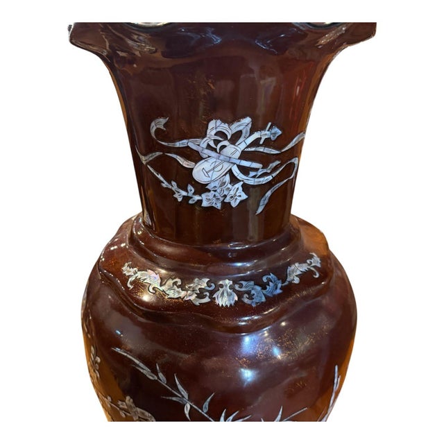 Beautiful vase with striking mother-of-pearl inlay. It features a baluster-shaped body with a flared, scalloped rim….a...