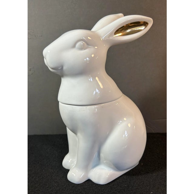 Beautiful two piece white figural rabbit cookie jar with gold ears. Perfect condition.