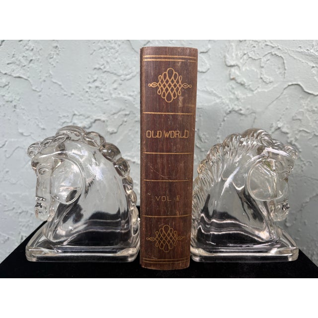 This striking pair of vintage clear pressed-glass horse head bookends was produced by Federal Glass Company in the 1940s,...