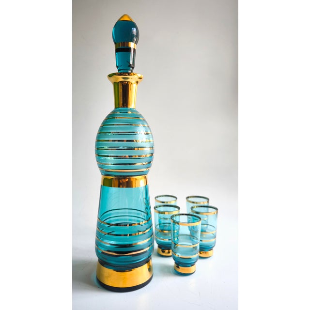 A spectacular modernist liquor set consisting of a bottle and five matching glasses, from Empoli in the Tuscany region of...