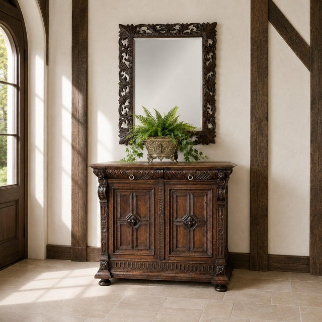 A striking 19th century Renaissance Revival mirror, hand-carved in oak with a beautifully pierced openwork frame and...
