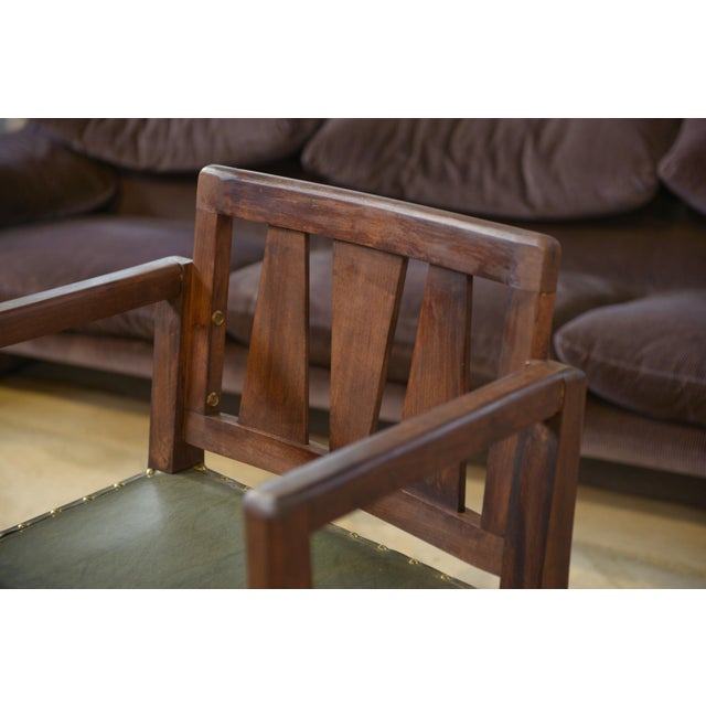 Arts & Crafts armchair in solid wood, with a simple and functional design, typical of the utilitarian furniture of the...