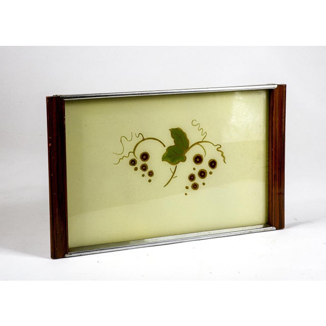 70s tray with grapes clusters and leaf paintings. Wooden parts and parts finished with chromed metal. Category: Mid-...