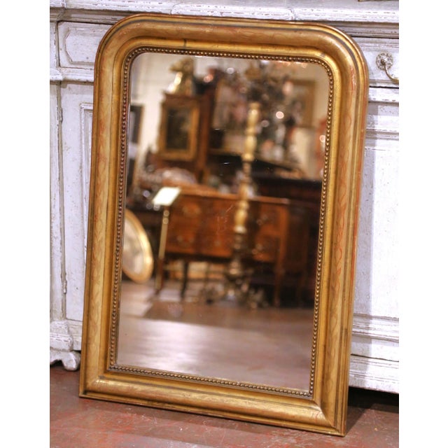 This elegant antique French Louis Philippe wall mirror, crafted circa 1870, features the classic understated silhouette of...