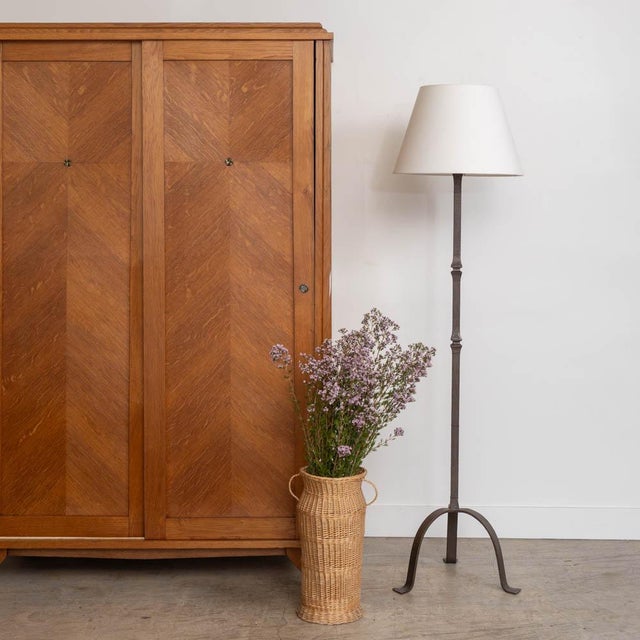 Lovely vintage wrought iron brutalist floor lamp from France, 1940s. Heavy iron stem with three curved iron legs. New...