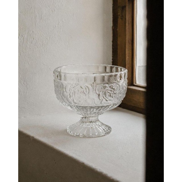 This vintage pressed glass footed bowl from the 1960s is a timeless centerpiece that combines elegant proportions with...