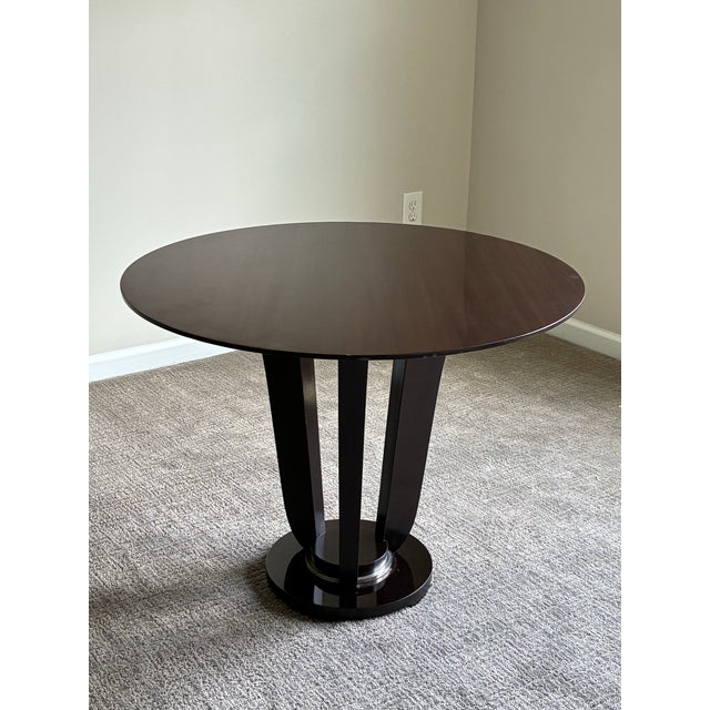 Elegant round pedestal table designed by Barbara Barry for Baker Furniture, embodying the designer’s signature restrained...