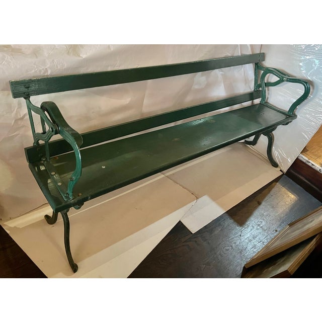 A wonderful find. Vintage railroad bench from the Hudson Valley with a cast iron base and wooden seat and back slat that...