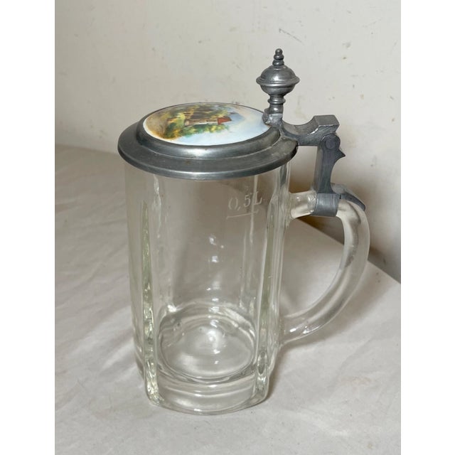 Up for sale is a nice quality antique glass and pewter/porcelain lidded German beer stein. The pewter lid has a wonderful...