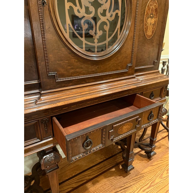Beautiful traditional European Revival display cabinet/vitrine featuring rich walnut-toned wood, intricate marquetry and...