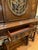 Beautiful traditional European Revival display cabinet/vitrine featuring rich walnut-toned wood, intricate marquetry and...