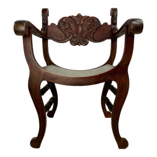 Antique Carved Back Stomps-Burkhardt Mahogany Saddle Arm Chair For Sale