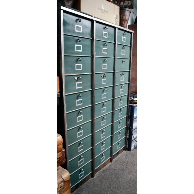 A superb Vintage Steel Strafor Clapet Locker. Made from rolled steel, comprising of 30 clapped lockers, all drop fronted,...