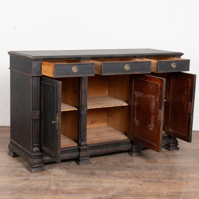19th century Swedish sideboard, crafted in pine. The cabinet features a three drawer over three door configuration, giving...