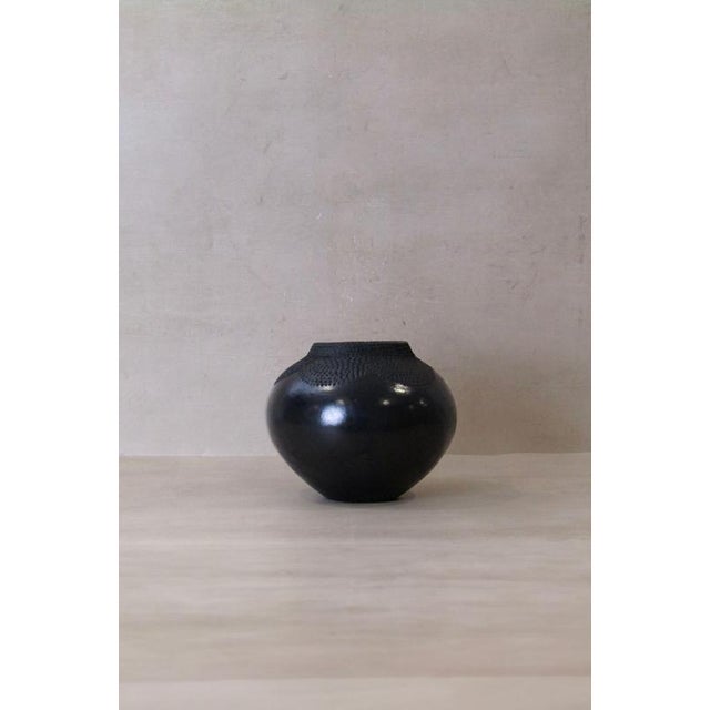 The Zulu pot, originating from South Africa, holds a distinguished role in the traditional practices of the Zulu people,...