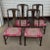 Set of baker dining chairs Dark walnut consisting of 4 arm and 2 side chairs reupholstered in a bright Ikat print....