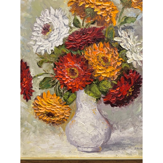 Beautiful vintage floral still life depicting a vibrant bouquet of dahlias and chrysanthemums arranged in a softly...