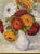 Beautiful vintage floral still life depicting a vibrant bouquet of dahlias and chrysanthemums arranged in a softly...