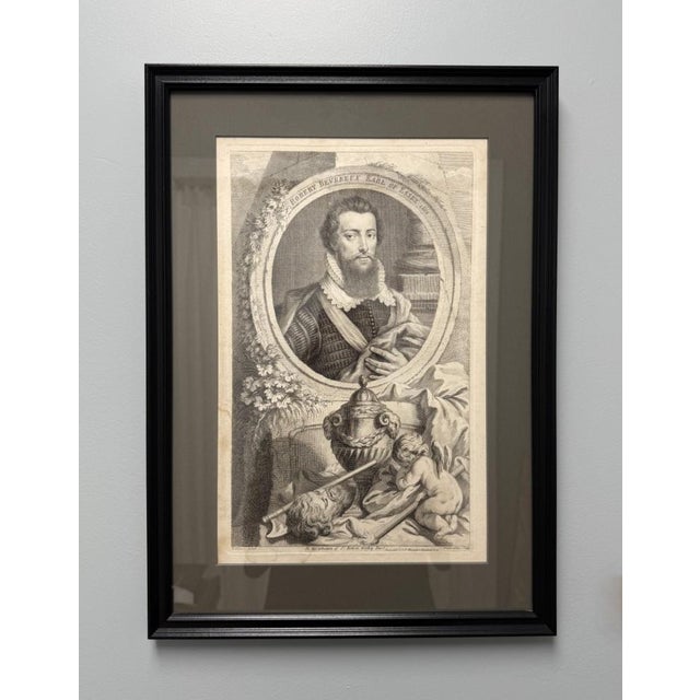 This 1741 engraving by Jacobus Houbraken presents Robert Devereux, Earl of Essex, in a finely detailed oval portrait,...